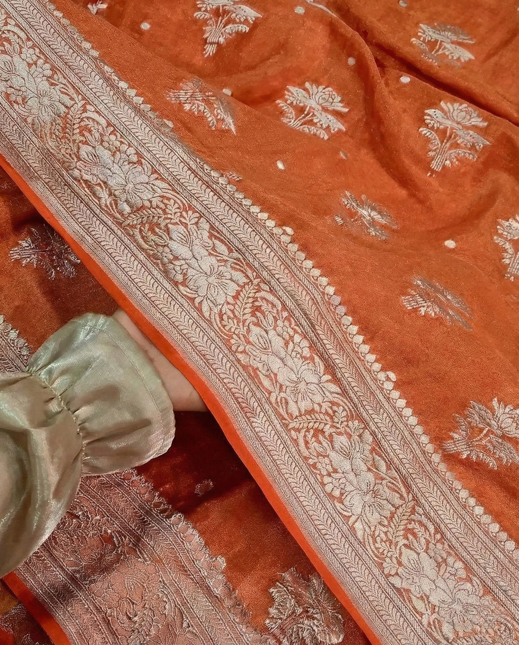 Roshni - Rust Orange Handwoven Tissue Georgette Saree with Silver Zari Floral Border