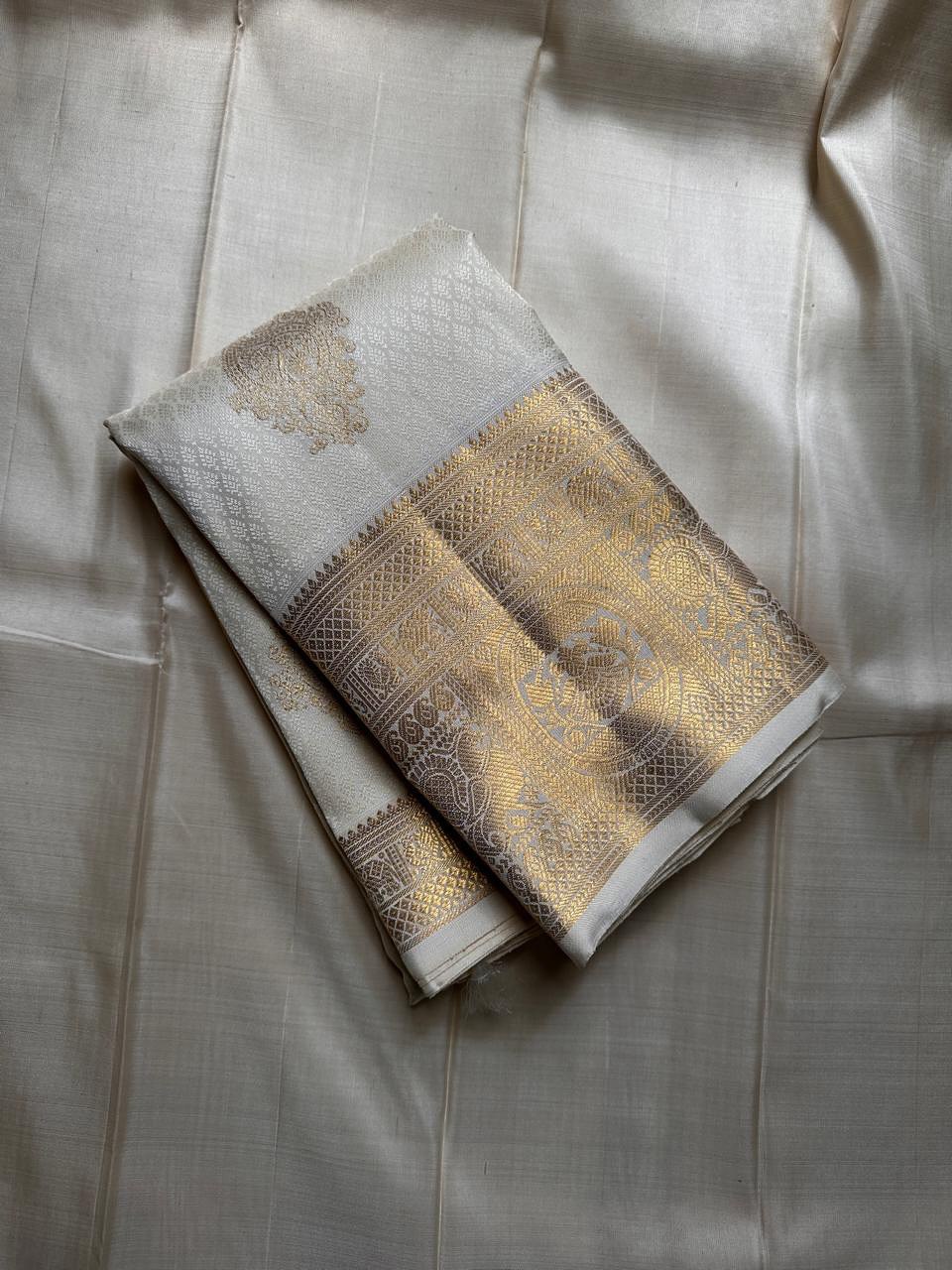 Dakshayani – Off White Banarasi Soft Silk Saree with Gold Zari Butti & Grand Border