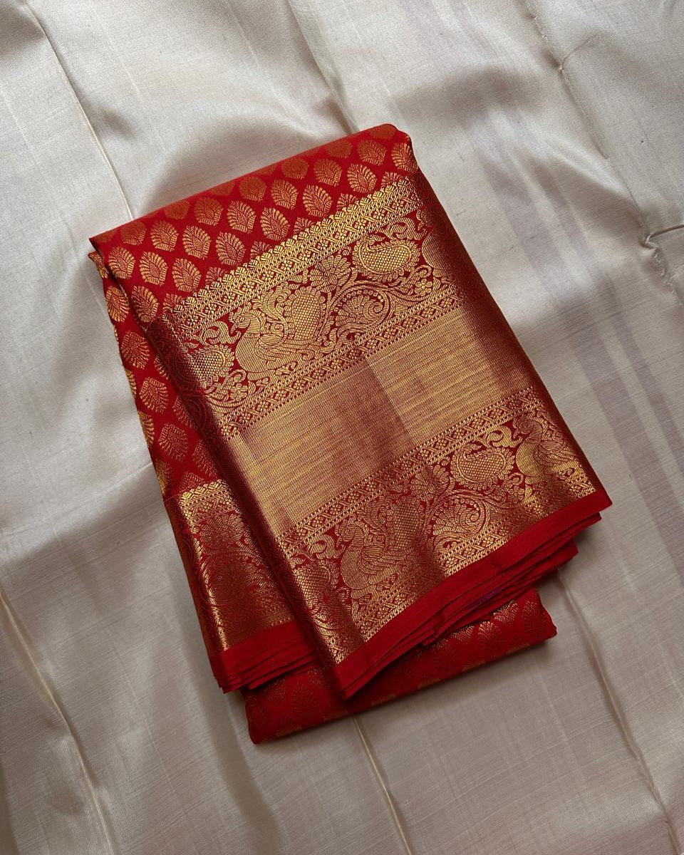 Shruti – Vermilion Red Banarasi Soft Silk Saree with Gold Butti & Regal Peacock Border