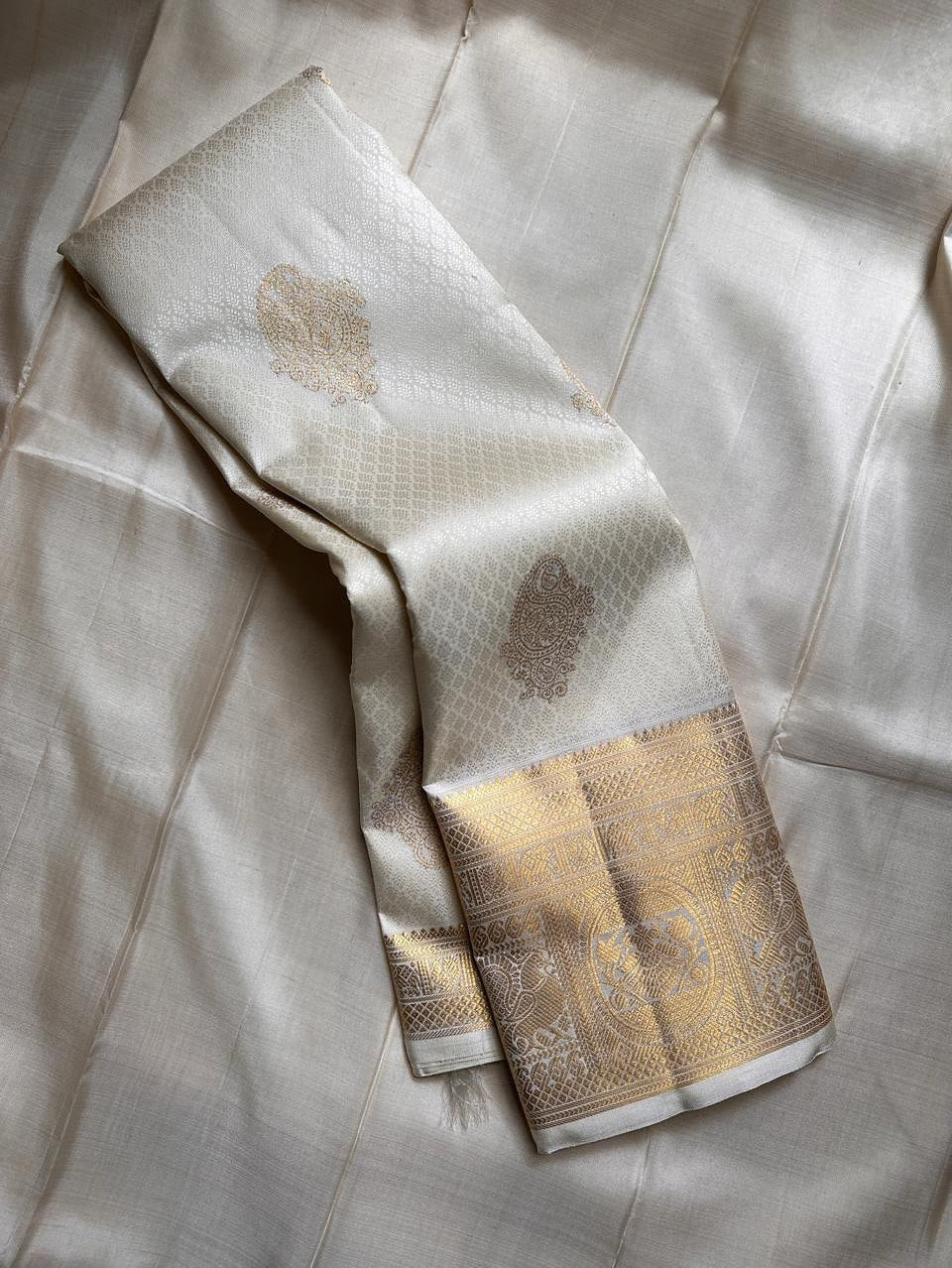 Dakshayani – Off White Banarasi Soft Silk Saree with Gold Zari Butti & Grand Border