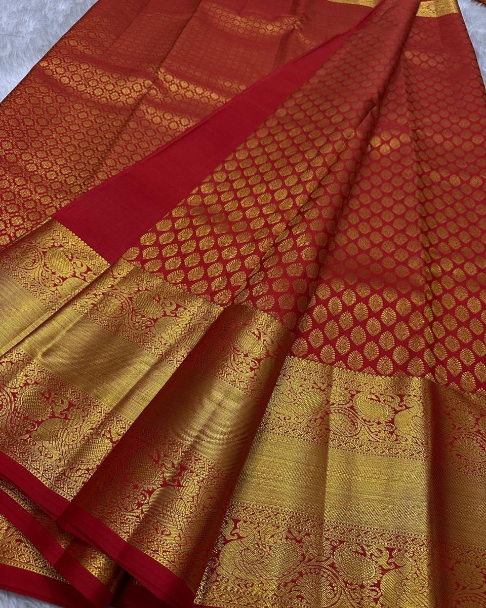 Shruti – Vermilion Red Banarasi Soft Silk Saree with Gold Butti & Regal Peacock Border
