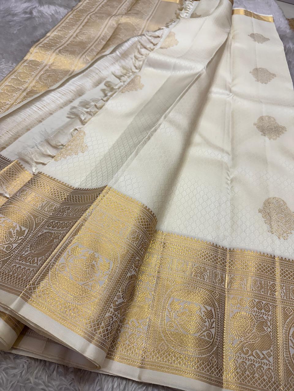 Dakshayani – Off White Banarasi Soft Silk Saree with Gold Zari Butti & Grand Border
